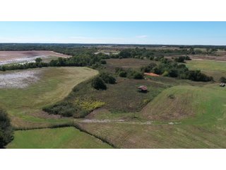 Property photo 4 - SIGNIFICANT LAND & PRODUCING MINERALS AUCTION - 237 +/- SURFACE ACRES IN 4 TRACTS - 18 MINERAL PACKAGES IN GARVIN, MCCLAIN, GRADY & ROGER MILLS COUNTIES, OK - 6 Mo. AVG. CASH FLOW of $196,376/Mo.